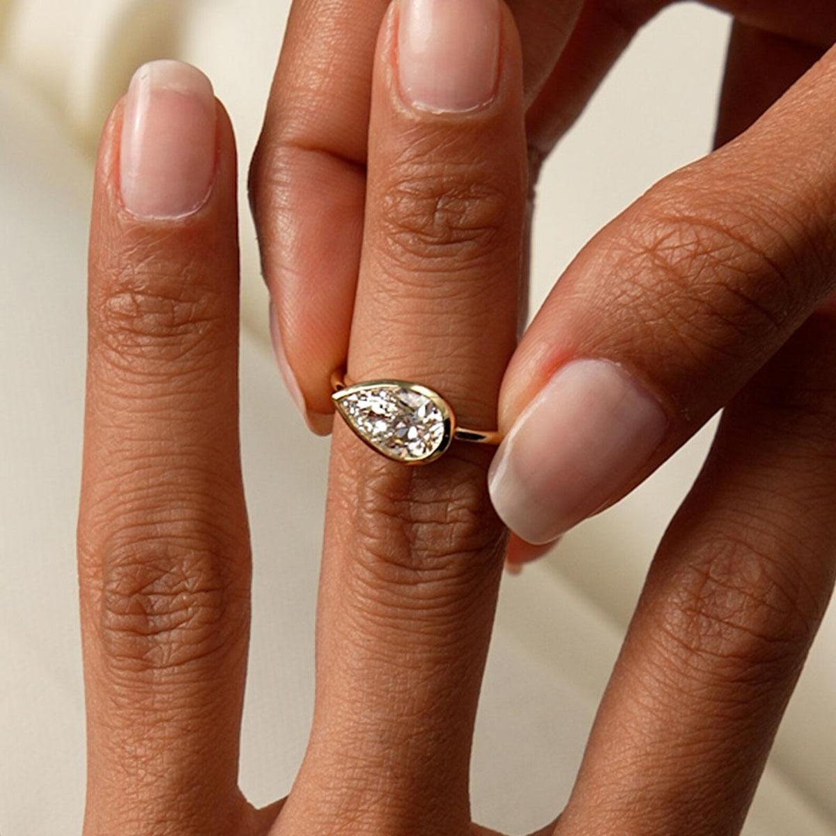 pear lab grown diamond engagement ring in gold, detail of the setting