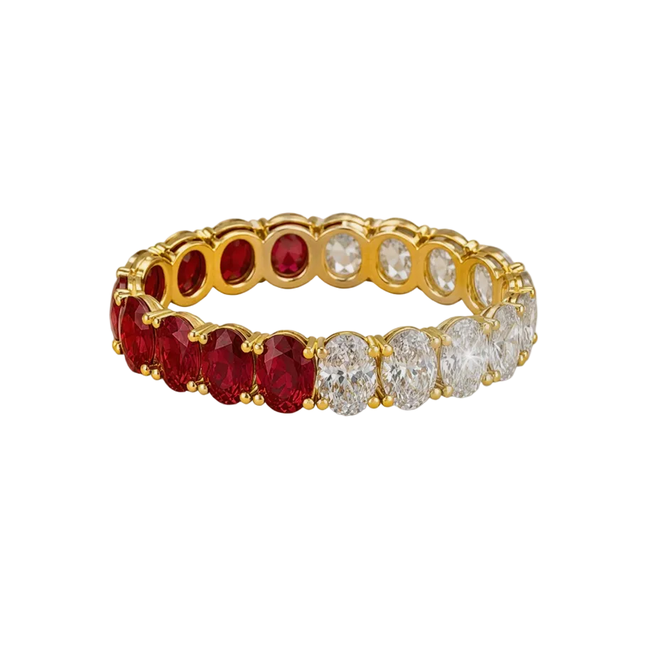 A gold eternity ring featuring a row of oval-cut red gemstones on one side and clear round-cut gemstones on the other, set against a plain white background.