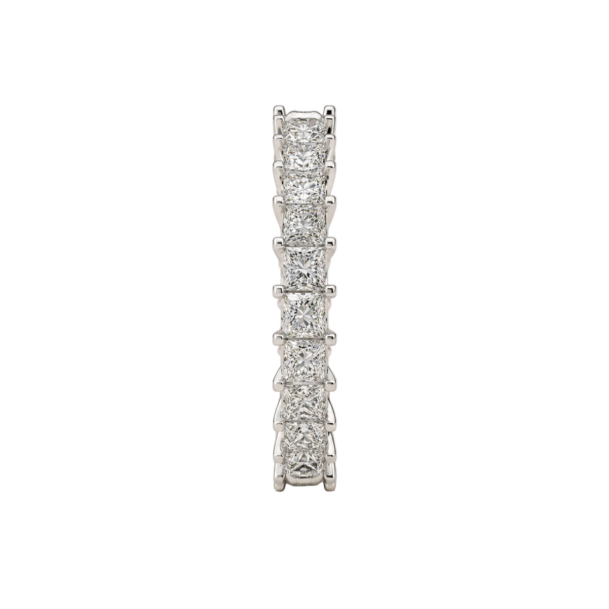 A single diamond eternity ring in a silver-toned setting, standing vertically on a textured light gray background.