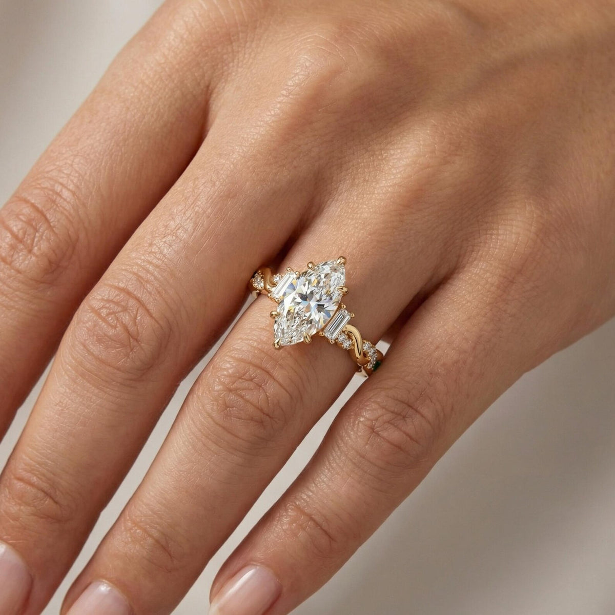 marquise lab grown diamond engagement ring in gold, detail of the setting