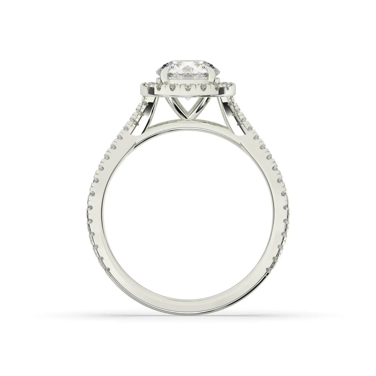 A silver-toned diamond engagement ring with a round-cut center stone and a halo setting, shown from the side on a clean white background.