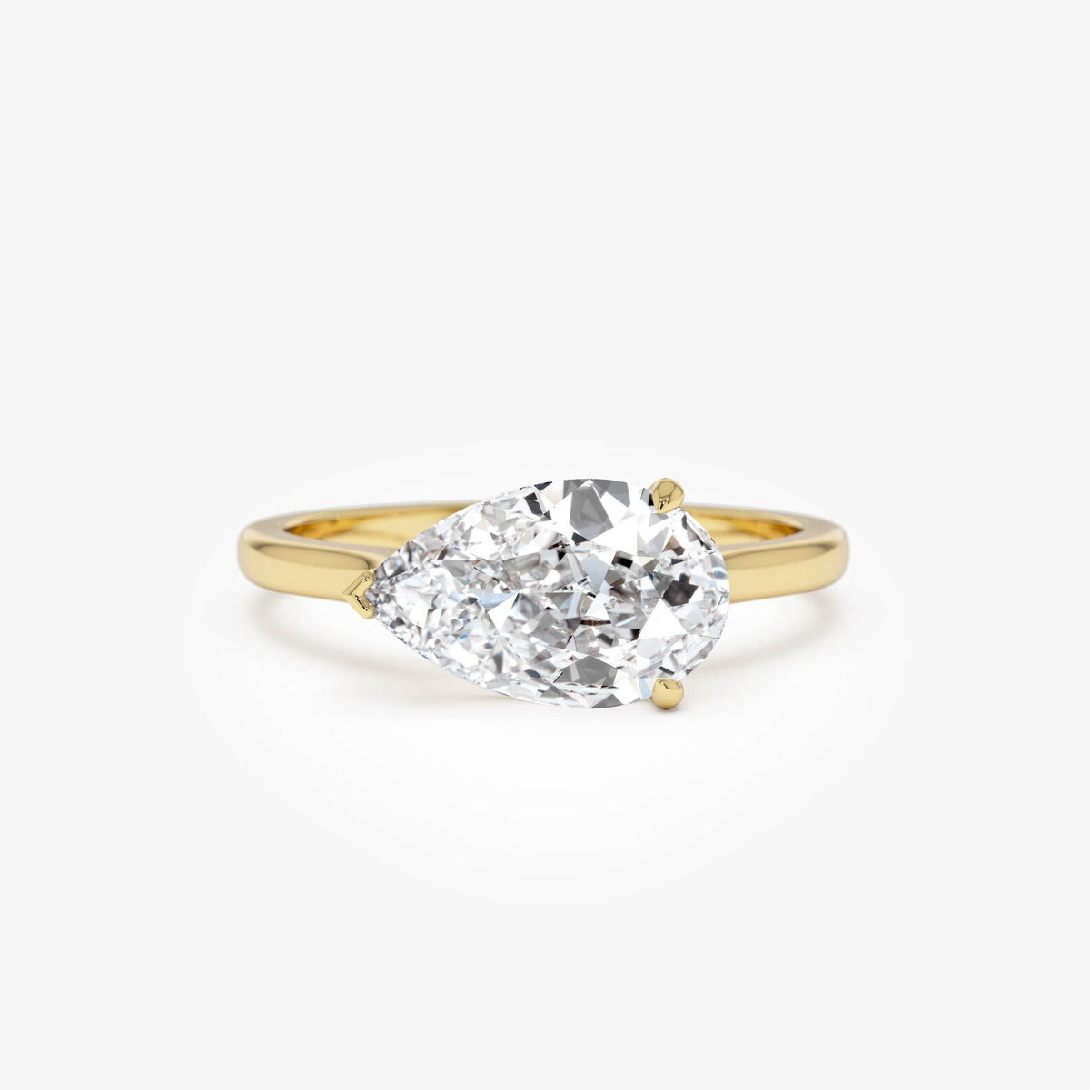pear lab grown diamond engagement ring in gold, three-quarter view