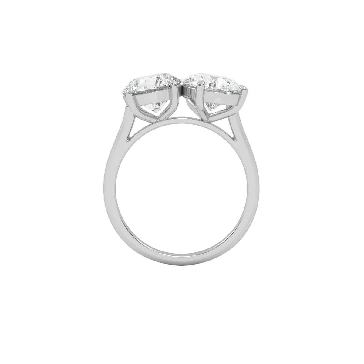 The Round and Pear Toi et Moi ring pairs the timeless brilliance