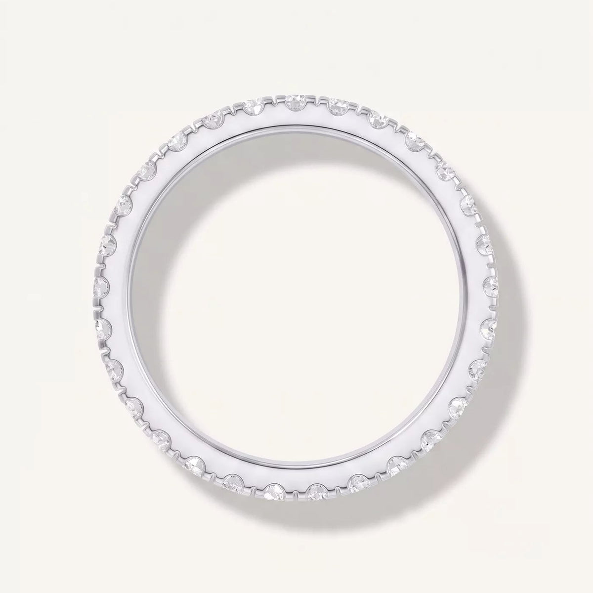 round lab grown diamond eternity band in metal, side profile
