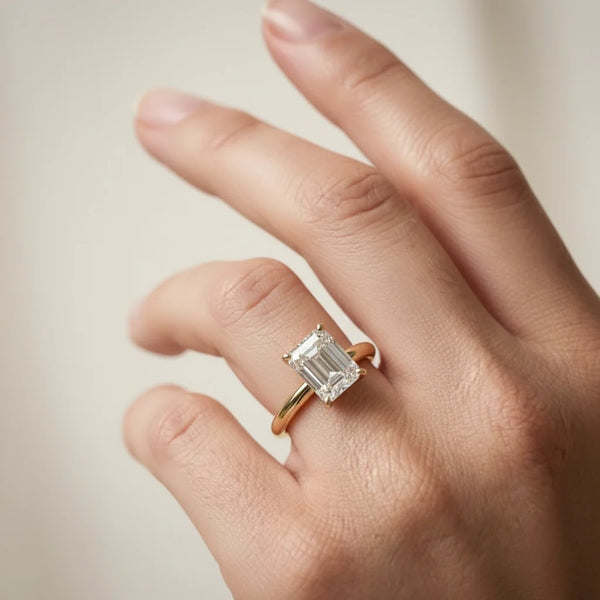 emerald lab grown diamond engagement ring in silver, three-quarter view