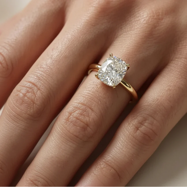 emerald lab grown diamond engagement ring in silver, three-quarter view