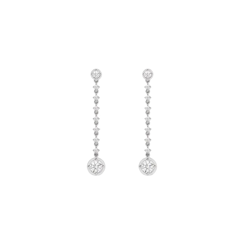 A pair of silver-tone dangle earrings with multiple small clear stones leading down to a larger round clear stone at the bottom, shown on a white background with a faint repeating watermark.