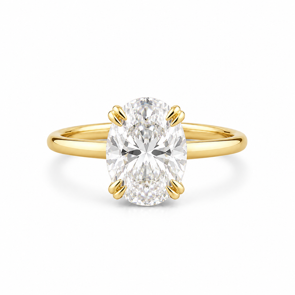 oval lab grown diamond engagement ring in gold, three-quarter view