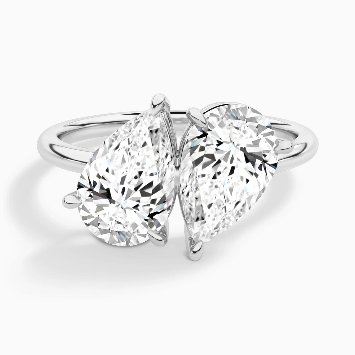 pear lab grown diamond engagement ring in various metals, three-quarter view