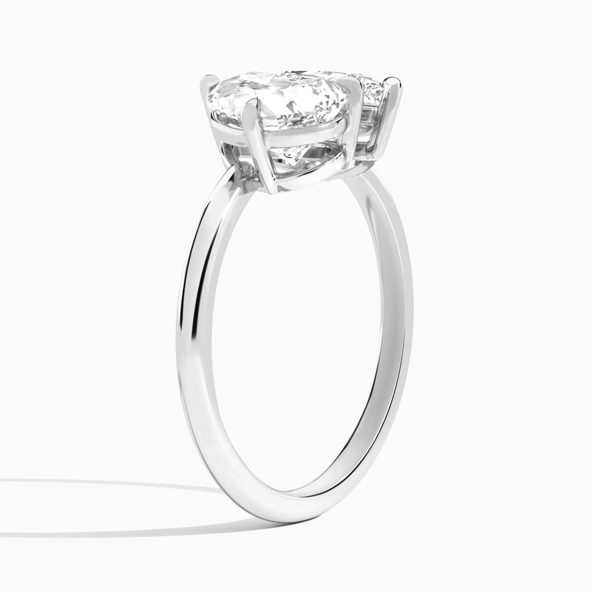 pear lab grown diamond engagement ring in various metals, top view