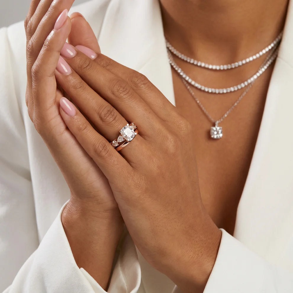 Round Cut Lab Grown Diamond & Moissanite Three Stone Engagement Ring with Pear Side Stones