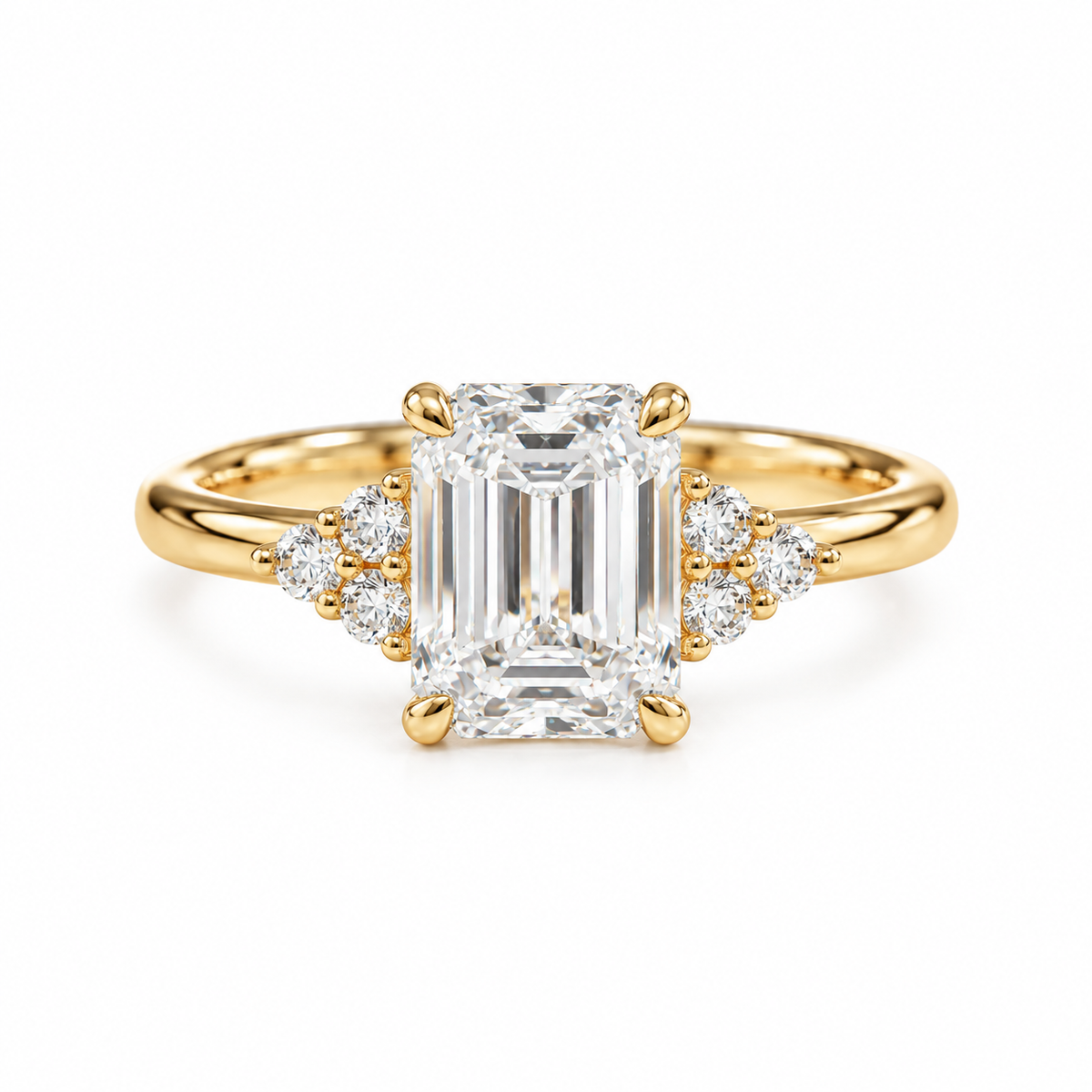 Emerald cut solitaire engagement ring with diamond cluster accents and tapered band