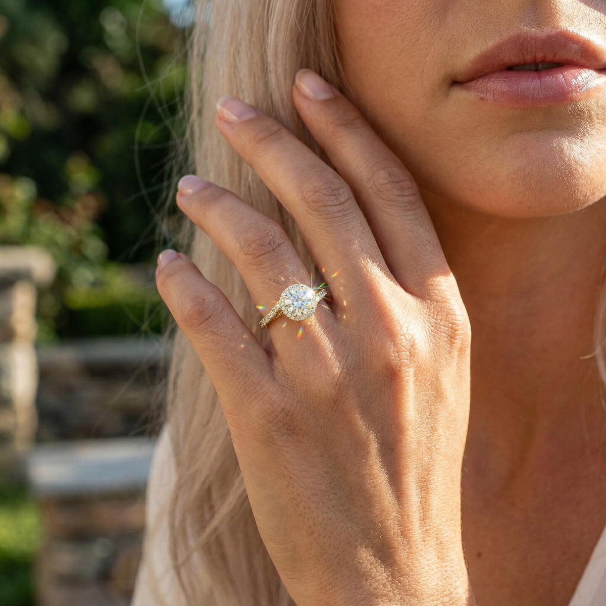 round lab grown diamond engagement ring in gold, angled view