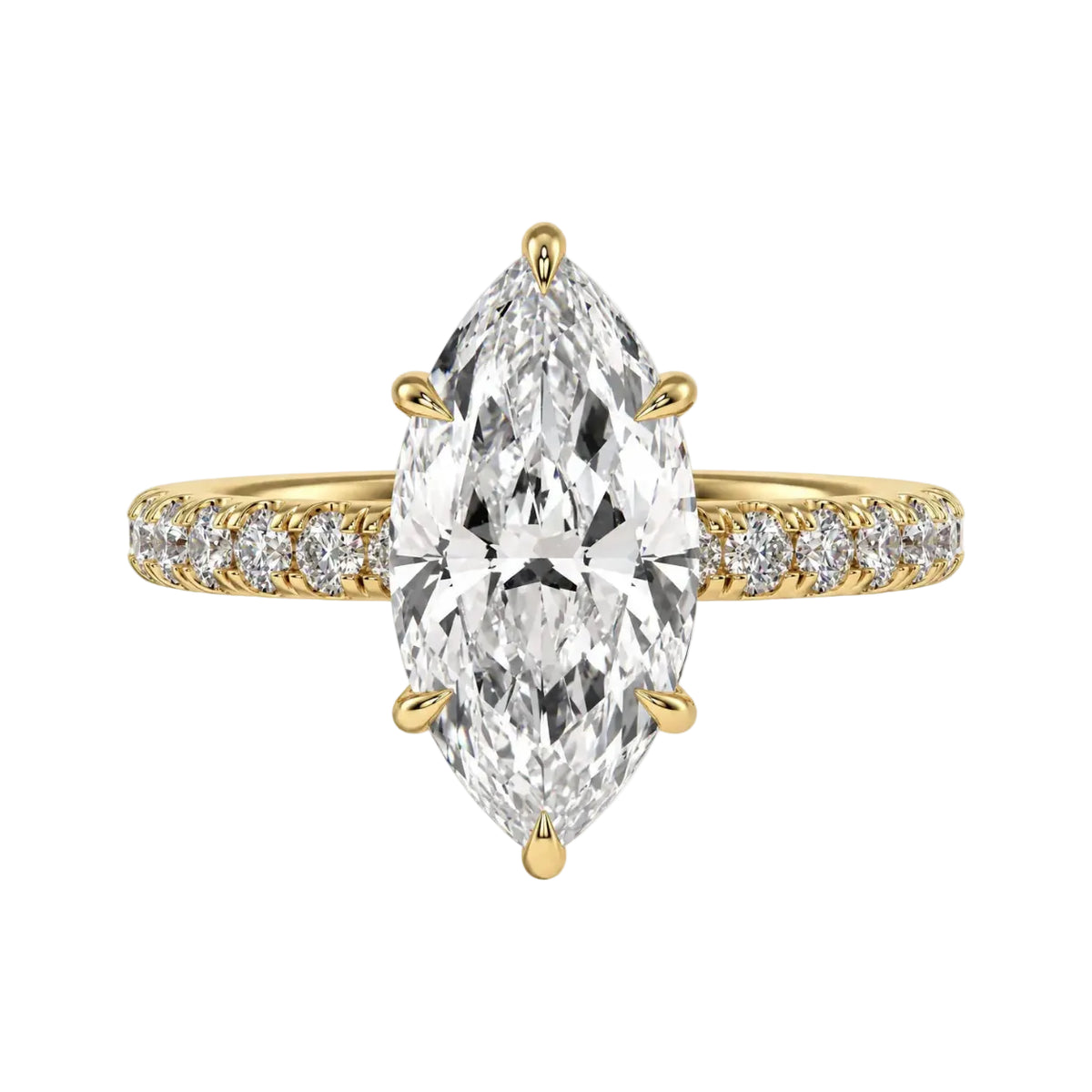 Gold ring with a large pear-shaped diamond and smaller diamonds on a beige background