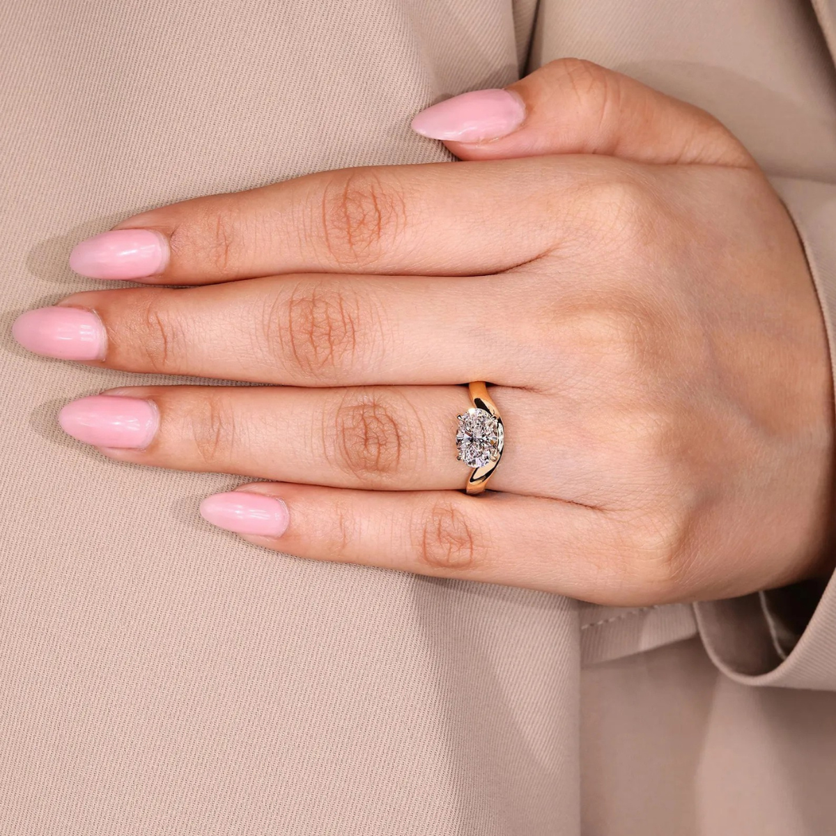 oval lab grown diamond engagement ring in gold, on-hand