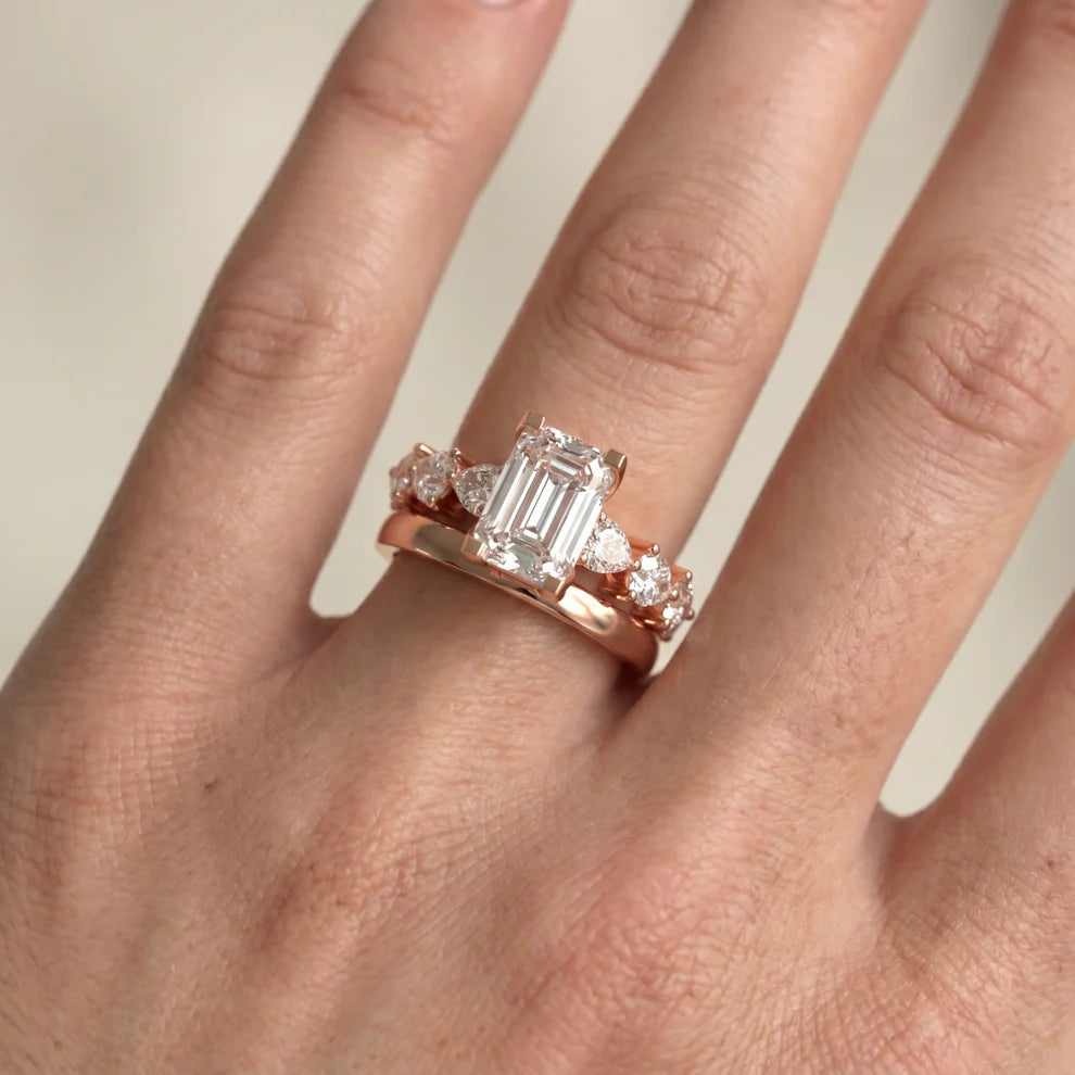 emerald lab grown diamond three stone engagement ring in 18k gold, side profile