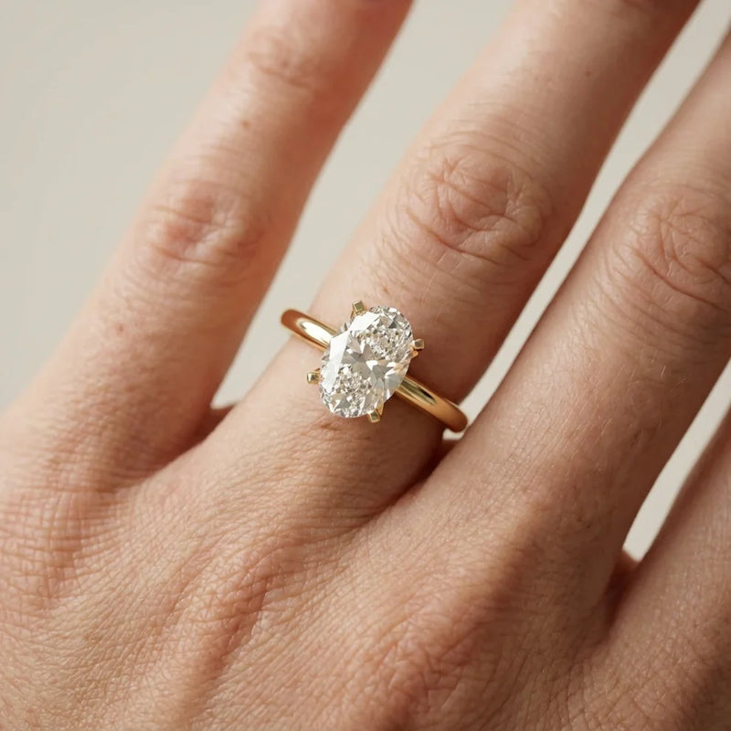 emerald lab grown diamond engagement ring in silver, three-quarter view