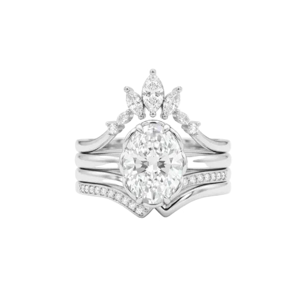 A silver-tone wedding band set featuring a large oval center diamond, a smaller marquise diamond, and pavé-set diamonds along the band, shown on a plain white background.