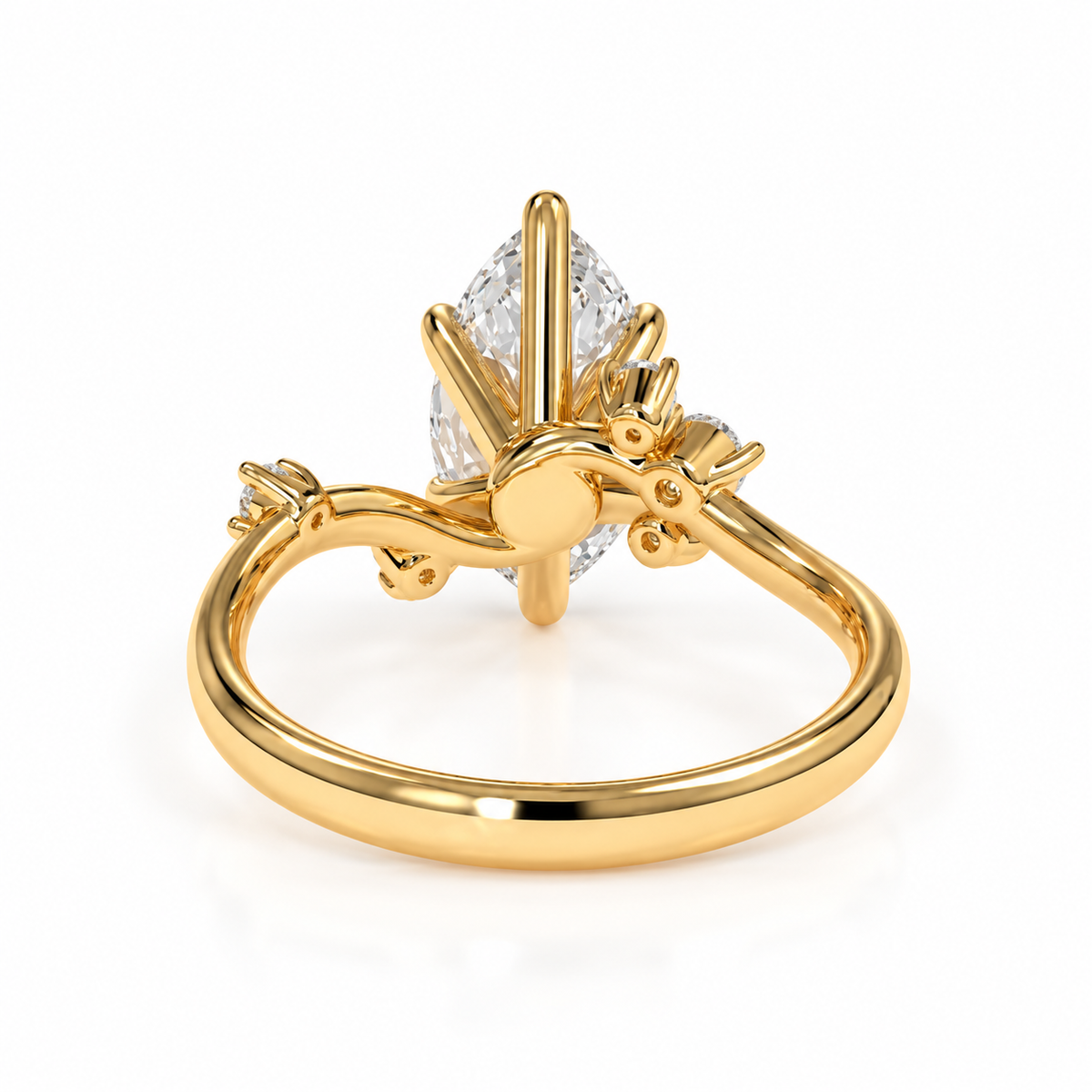 A gold ring featuring a marquise-cut diamond set in a decorative openwork crown-like setting with small side stones, shown on a plain white background.